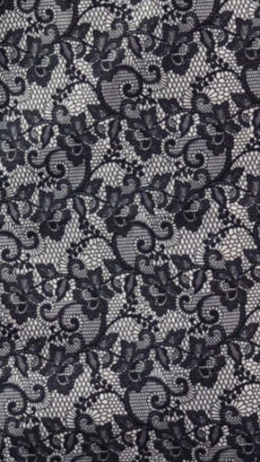 close up of black lace ivory background