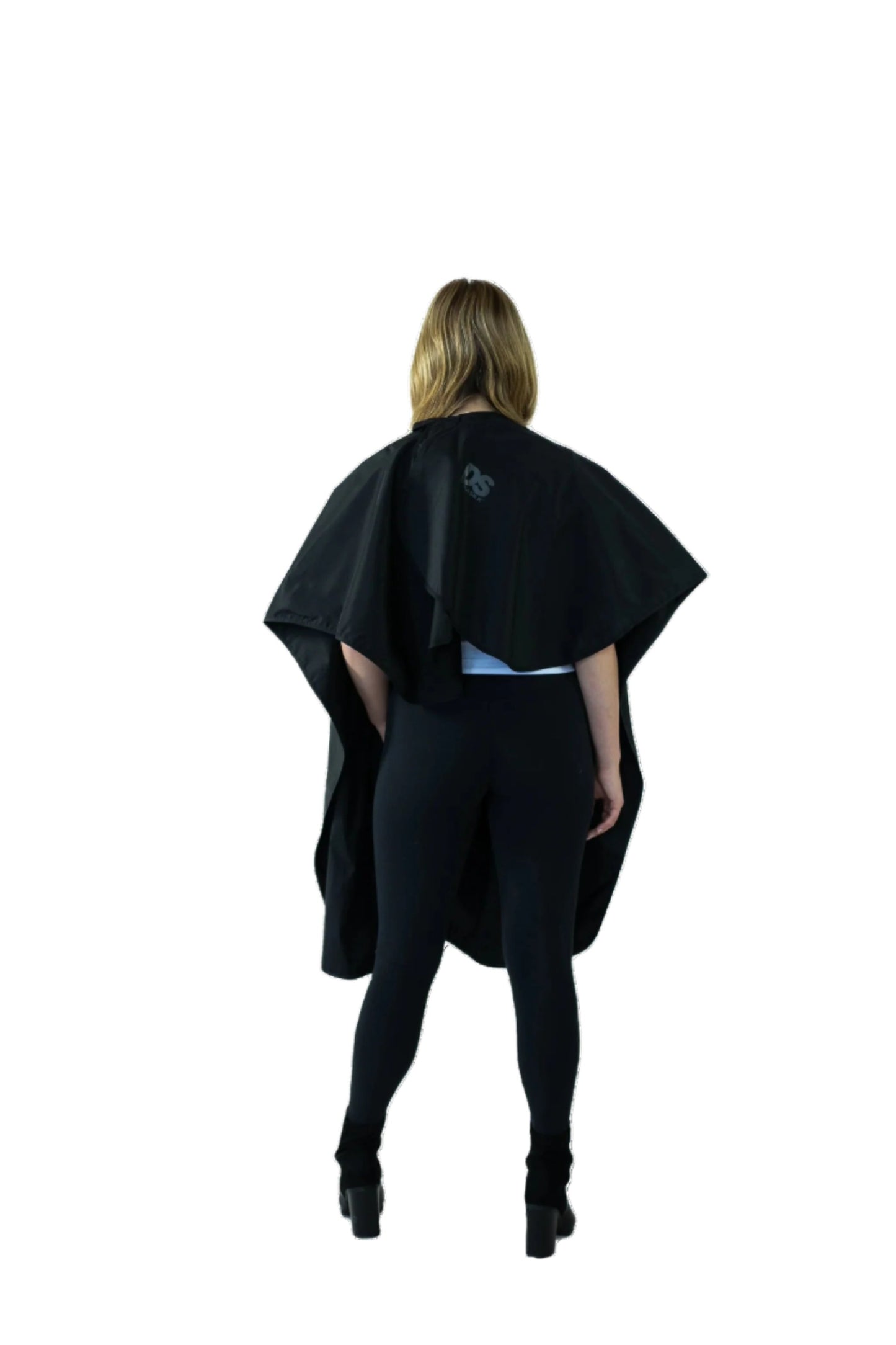 The back view of a woman adorned in a stylish cape
